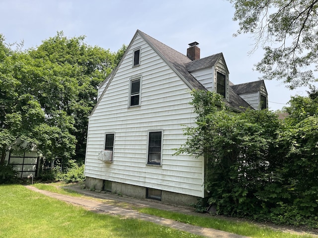 63 Park Rd, Hamden, CT 06517 - view of side of home with a chimney and roof with shingles