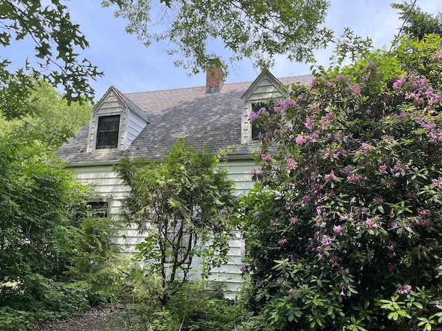 63 Park Rd, Hamden, CT 06517 - view of front of home featuring a chimney and roof with shingles