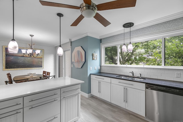85 Viscount Dr Unit 15C, Milford, CT 06460 - kitchen with stainless steel dishwasher, a sink, ceiling fan, light wood-style floors, and a chandelier