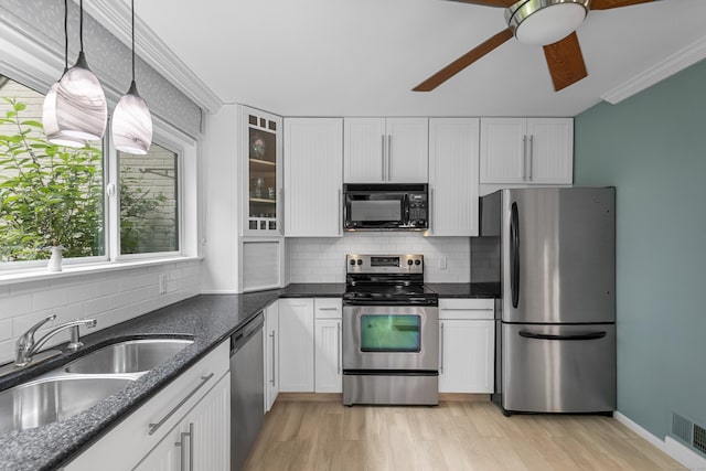 85 Viscount Dr Unit 15C, Milford, CT 06460 - kitchen featuring appliances with stainless steel finishes, a sink, ceiling fan, white cabinets, and crown molding