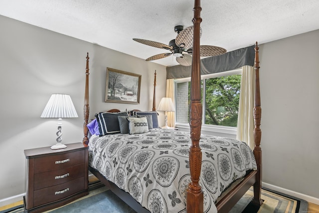 85 Viscount Dr Unit 15C, Milford, CT 06460 - bedroom with a textured ceiling, baseboards, and a ceiling fan