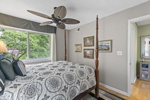 85 Viscount Dr Unit 15C, Milford, CT 06460 - bedroom with wood finished floors, baseboards, ceiling fan, and attic access