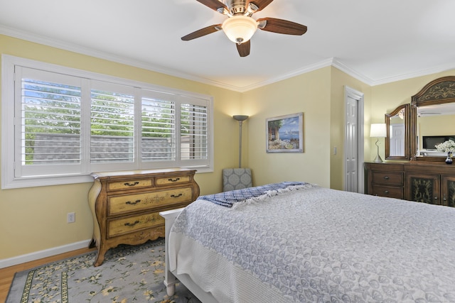 85 Viscount Dr Unit 15C, Milford, CT 06460 - bedroom with baseboards, wood finished floors, crown molding, and a ceiling fan
