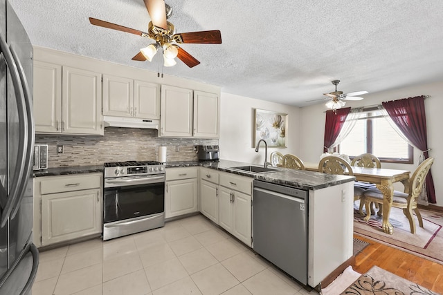 3 Jeffrey Alan Dr, Manchester, CT 06042 - kitchen featuring appliances with stainless steel finishes, a ceiling fan, a peninsula, under cabinet range hood, and a sink