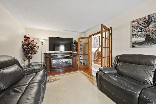 3 Jeffrey Alan Dr, Manchester, CT 06042 - living area featuring wood finished floors and stairway