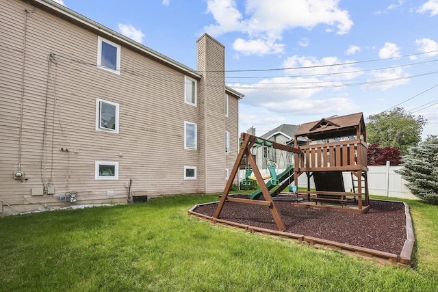 3 Jeffrey Alan Dr, Manchester, CT 06042 - rear view of property with a playground and a chimney
