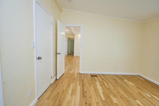 10 Crescent Park Rd, Westport, CT 06880 - spare room featuring light wood-style floors and ornamental molding