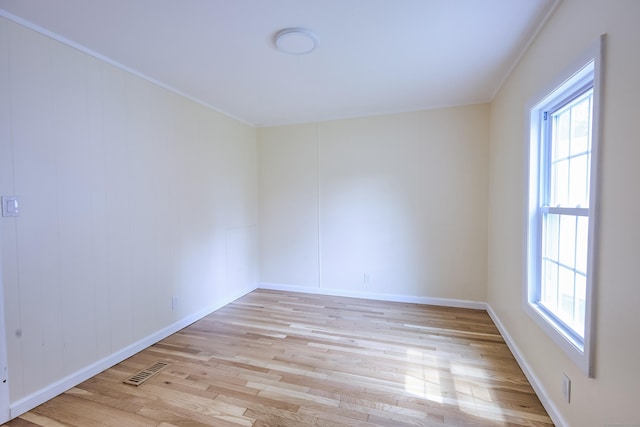10 Crescent Park Rd, Westport, CT 06880 - unfurnished room with light wood-style floors, plenty of natural light, and crown molding