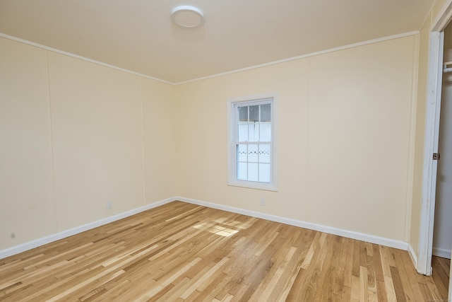 10 Crescent Park Rd, Westport, CT 06880 - spare room with light wood-style flooring and crown molding