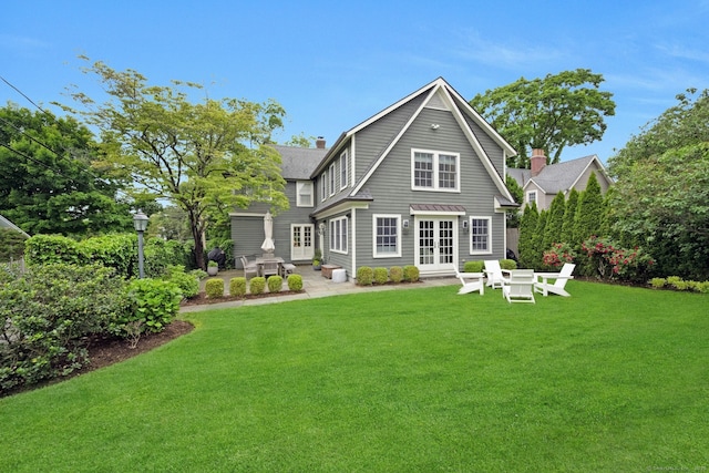 6 Prescott Ln, Greenwich, CT 06830 - back of house with french doors, a lawn, a patio, and a chimney
