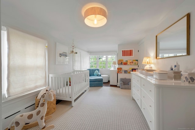 6 Prescott Ln, Greenwich, CT 06830 - bedroom featuring light carpet, a crib, and a baseboard heating unit
