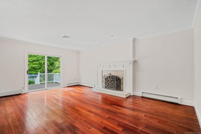 22 Loomis Dr, Coventry, CT 06238 - unfurnished living room featuring a baseboard heating unit, ornamental molding, wood finished floors, a tile fireplace, and baseboards