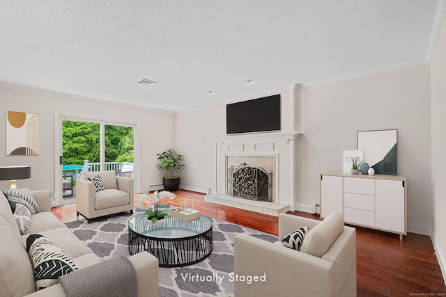 22 Loomis Dr, Coventry, CT 06238 - living room with crown molding, wood finished floors, a tile fireplace, a baseboard heating unit, and baseboards