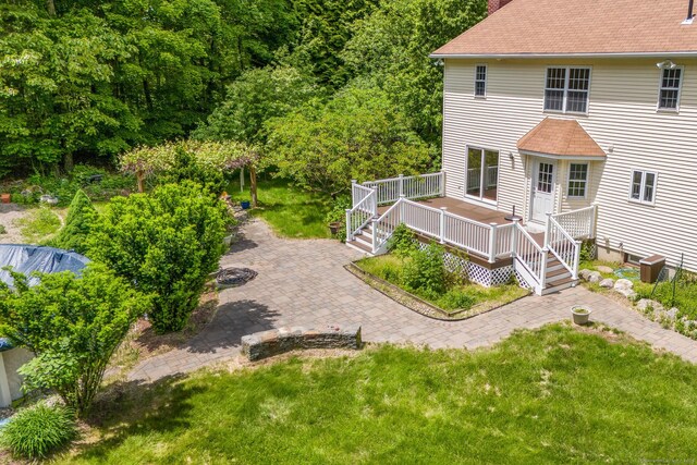 22 Loomis Dr, Coventry, CT 06238 - rear view of house featuring a deck, a chimney, a lawn, and a shingled roof