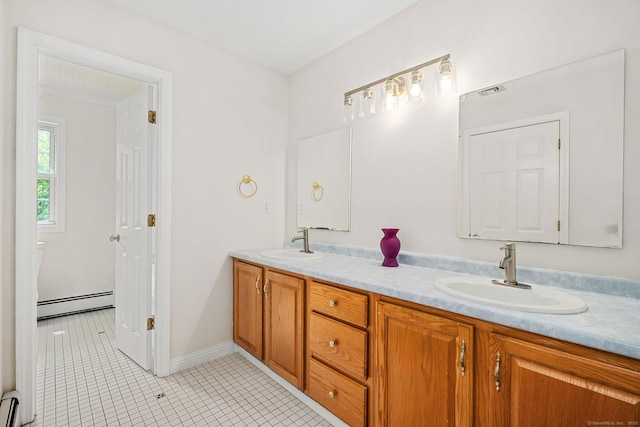22 Loomis Dr, Coventry, CT 06238 - full bathroom with a baseboard heating unit, double vanity, tile patterned flooring, and baseboards