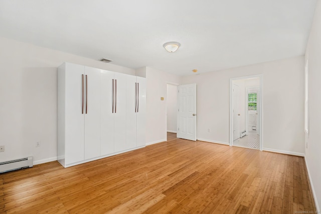 22 Loomis Dr, Coventry, CT 06238 - unfurnished bedroom featuring light wood-type flooring, baseboards, and baseboard heating