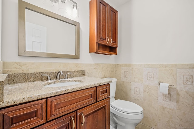 22 Loomis Dr, Coventry, CT 06238 - bathroom with toilet, vanity, tile walls, and wainscoting