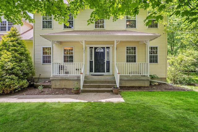 22 Loomis Dr, Coventry, CT 06238 - view of front of house featuring covered porch and a front lawn
