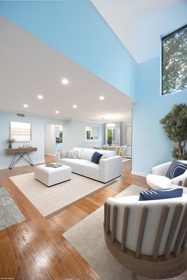 45 Ettl Ln Unit 301, Greenwich, CT 06831 - living room with recessed lighting, wood finished floors, baseboards, and a chandelier