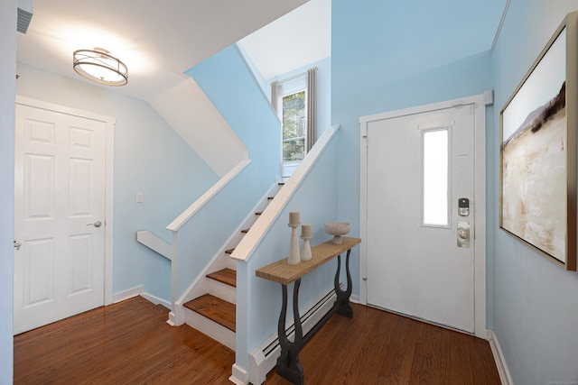 45 Ettl Ln Unit 301, Greenwich, CT 06831 - foyer entrance featuring a baseboard heating unit, wood finished floors, stairs, and baseboards