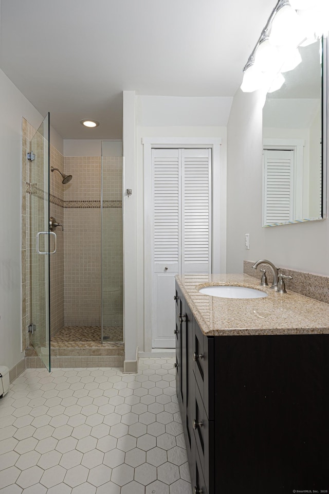 45 Ettl Ln Unit 301, Greenwich, CT 06831 - bathroom featuring vanity, a stall shower, recessed lighting, and a closet