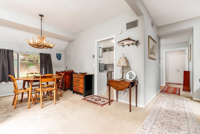 21 Heritage Vlg Unit B, Southbury, CT 06488 - dining room with a chandelier, light carpet, and baseboards