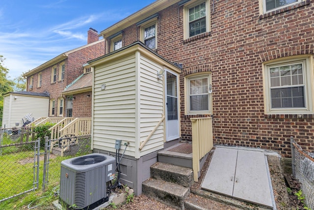 151 Alsace St, Bridgeport, CT 06604 - back of house with central air condition unit and brick siding