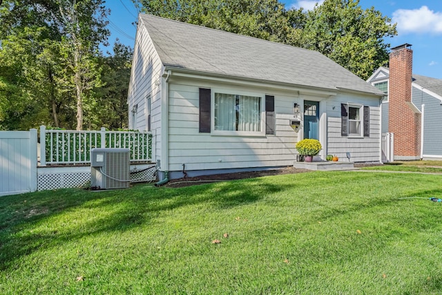 45 Coolidge Ave, Stamford, CT 06906 - view of front of home featuring central AC, a front lawn, and a shingled roof