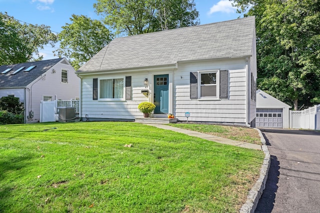 45 Coolidge Ave, Stamford, CT 06906 - view of front of property featuring a garage, a shingled roof, and an outdoor structure