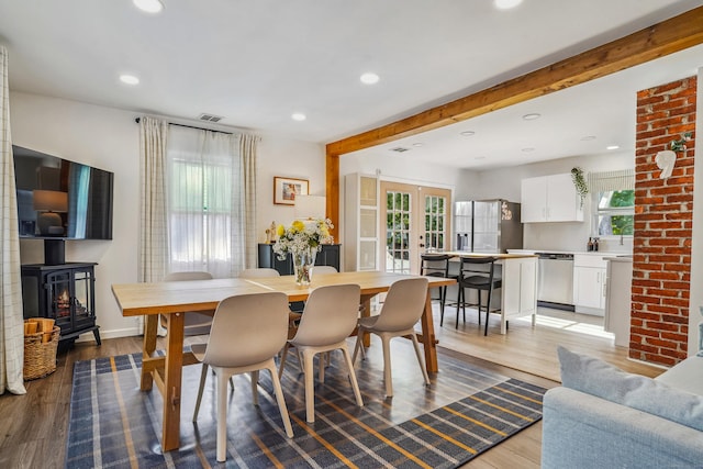 45 Coolidge Ave, Stamford, CT 06906 - dining room with french doors, healthy amount of natural light, light wood-style floors, recessed lighting, and beamed ceiling