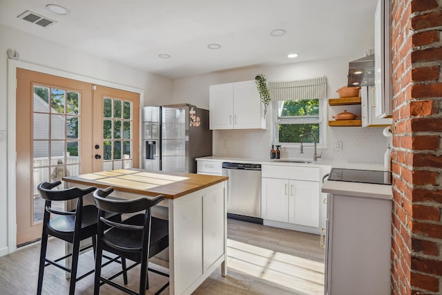 45 Coolidge Ave, Stamford, CT 06906 - kitchen with appliances with stainless steel finishes, a sink, healthy amount of natural light, french doors, and recessed lighting