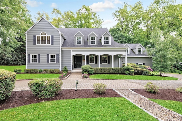 6 Cavray Rd, Norwalk, CT 06855 - view of front facade with covered porch, a front yard, and a shingled roof