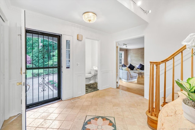6 Cavray Rd, Norwalk, CT 06855 - entrance foyer with stairway, ornamental molding, and rail lighting