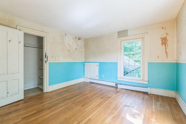 30 Mountain Ave, Winchester, CT 06098 - unfurnished bedroom with a baseboard heating unit, wood finished floors, and baseboards