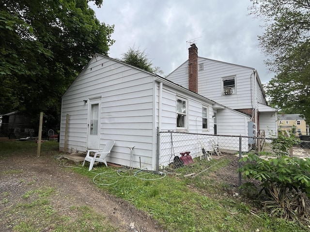 19 Outlook St, East Hartford, CT 06108 - rear view of house with a chimney