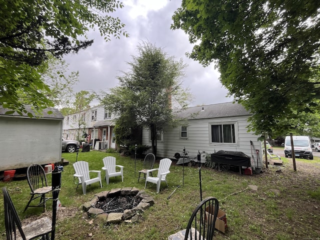 19 Outlook St, East Hartford, CT 06108 - view of green lawn with an outdoor fire pit