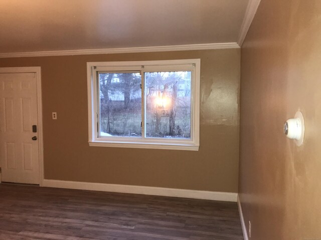 19 Outlook St, East Hartford, CT 06108 - spare room featuring dark wood-style floors, baseboards, and ornamental molding