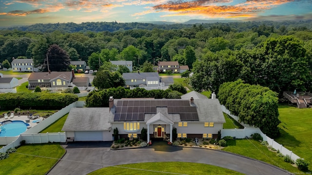 9 Marion Ct, North Haven, CT 06473 - aerial view at dusk of a wooded view, a residential view, and view of pool