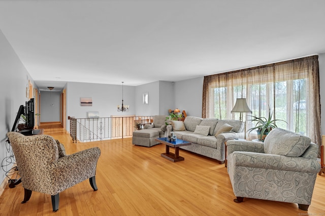 9 Marion Ct, North Haven, CT 06473 - living room featuring a chandelier and light wood finished floors