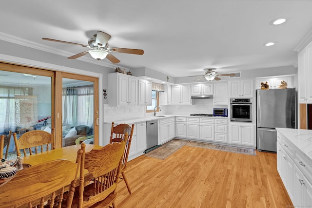 9 Marion Ct, North Haven, CT 06473 - kitchen featuring appliances with stainless steel finishes, ceiling fan, backsplash, white cabinets, and recessed lighting