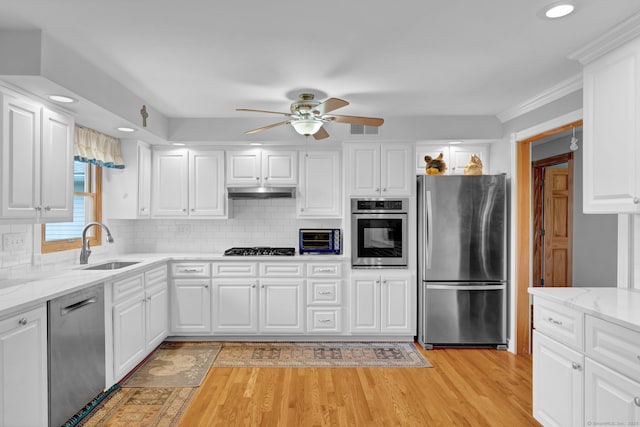 9 Marion Ct, North Haven, CT 06473 - kitchen featuring stainless steel appliances, ceiling fan, light wood-style floors, white cabinetry, and recessed lighting