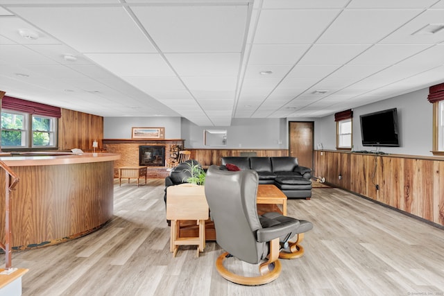 9 Marion Ct, North Haven, CT 06473 - living area with a paneled ceiling, a wainscoted wall, light wood-type flooring, bar area, and a fireplace