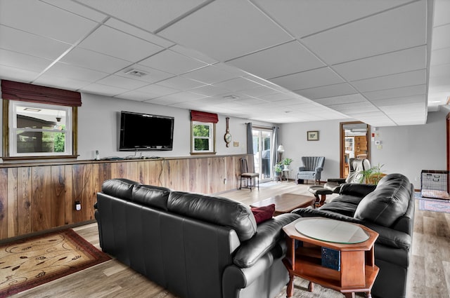 9 Marion Ct, North Haven, CT 06473 - living room featuring a paneled ceiling, wood finished floors, wainscoting, and wood walls
