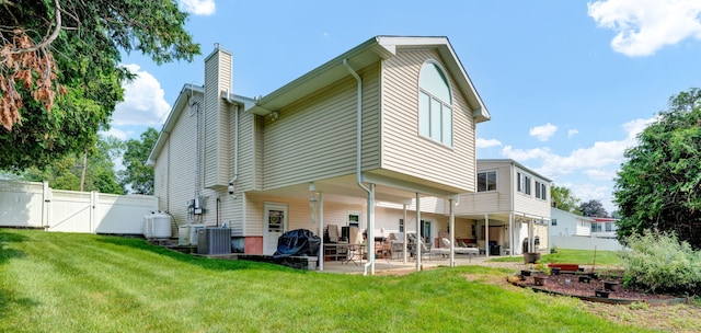 9 Marion Ct, North Haven, CT 06473 - rear view of property featuring a gate, a chimney, and a patio