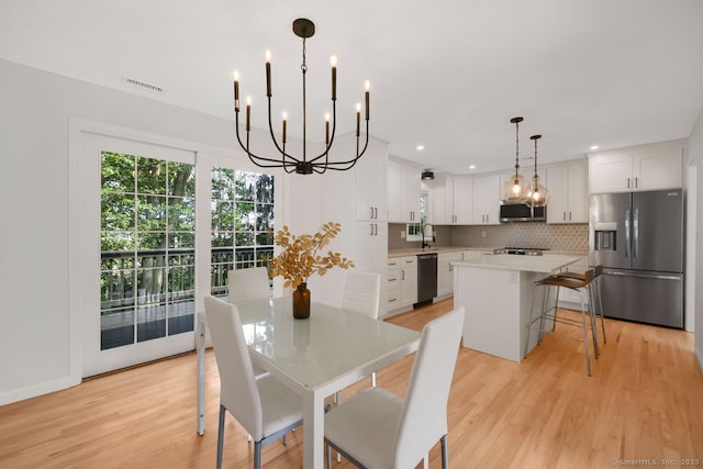 29 Magellan Dr, Milford, CT 06460 - dining space featuring a chandelier, light wood-style flooring, and recessed lighting