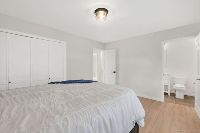 29 Magellan Dr, Milford, CT 06460 - bedroom featuring a closet, light wood-style floors, and ensuite bath