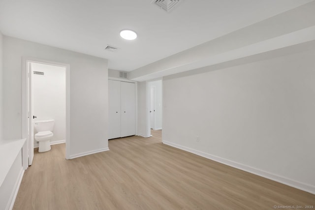 29 Magellan Dr, Milford, CT 06460 - unfurnished bedroom with light wood-style flooring, ensuite bath, and a closet