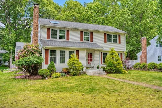 26 Lighthouse Hill Rd, Windsor, CT 06095 - view of front of home with a chimney, a front yard, and roof with shingles