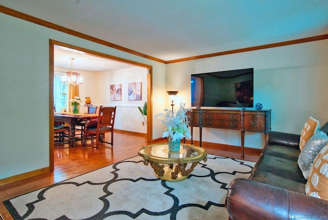 26 Lighthouse Hill Rd, Windsor, CT 06095 - living room with wood finished floors, a chandelier, ornamental molding, and baseboards