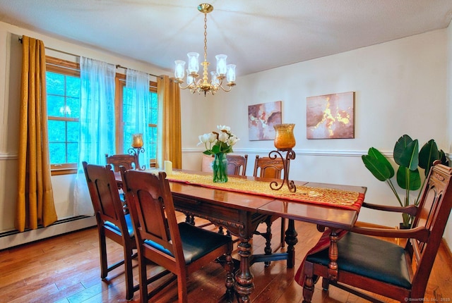 26 Lighthouse Hill Rd, Windsor, CT 06095 - dining room featuring a chandelier and wood-type flooring
